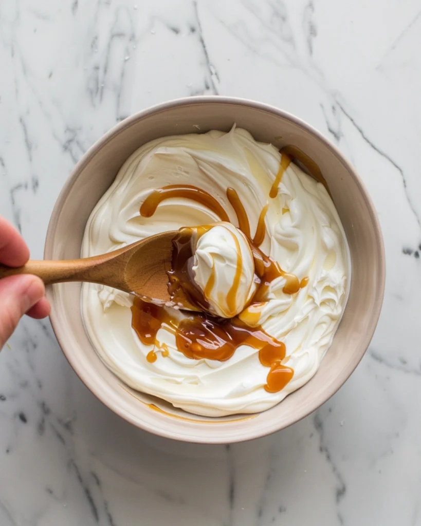 Salted Caramel Banana Yogurt Bowls – 5 Irresistible Reasons to Try This Power Snack 3 Overhead view of caramel being swirled into yogurt