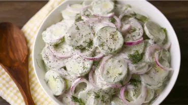 Creamy cucumber salad with dill and onions