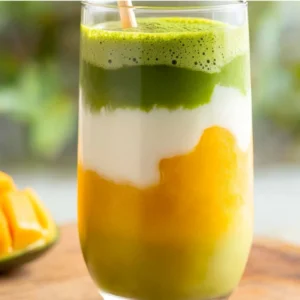 iced mango matcha latte in layered glass
