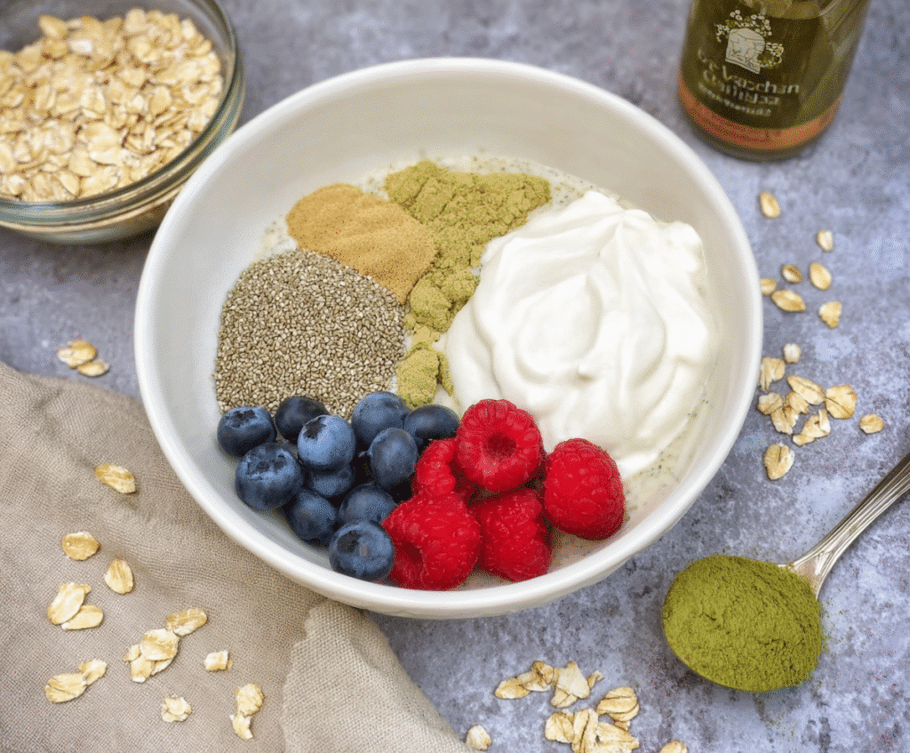 ingredients for matcha overnight oats on a white background