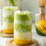 iced mango matcha latte in layered glass