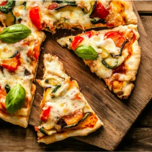 Cottage cheese crust pizza with fresh toppings on a rustic board