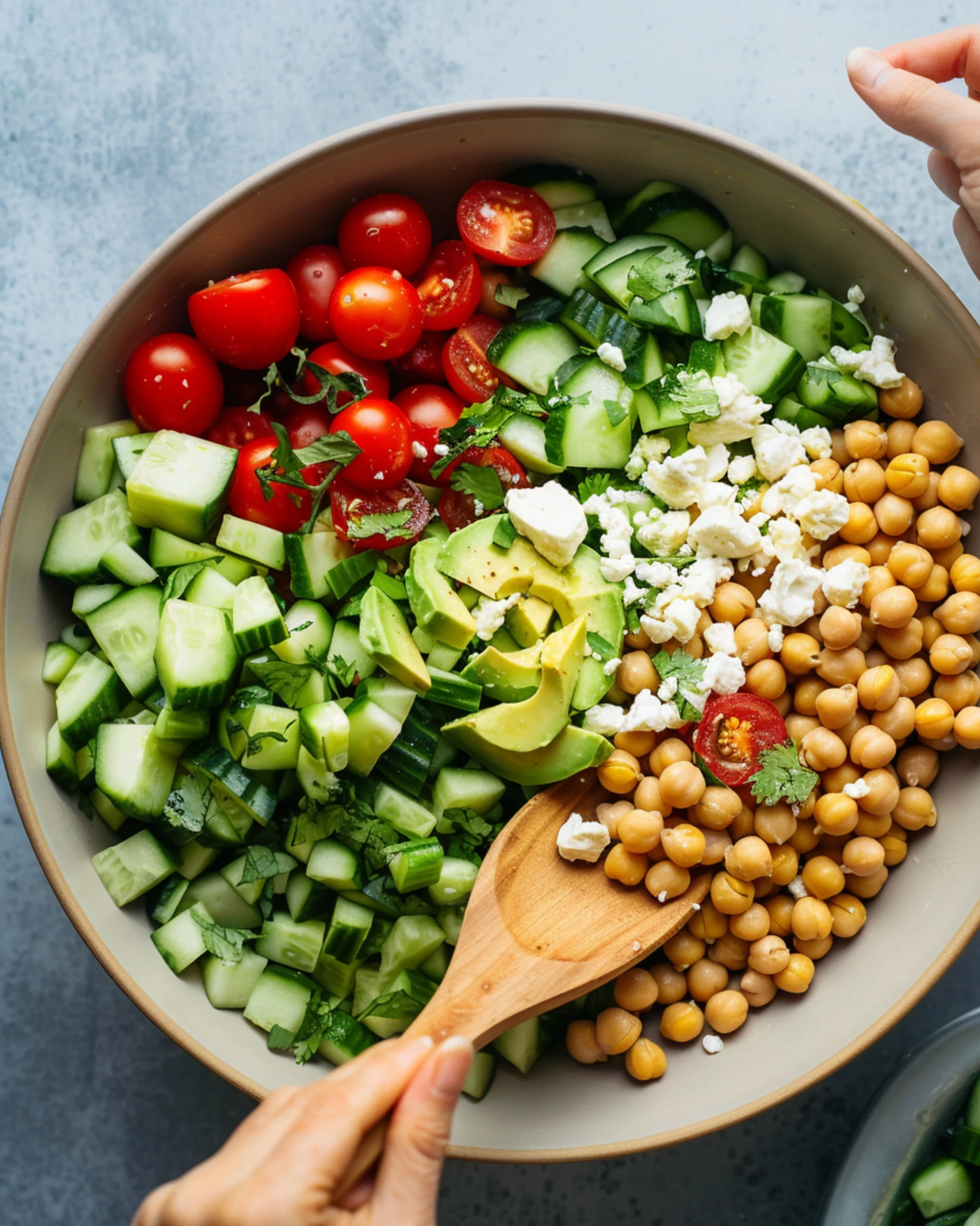 Tossing Chickpea Feta Avocado Salad