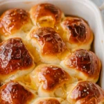 op-down view of Honey Butter Pull-Apart Rolls glazed with honey and cinnamon.