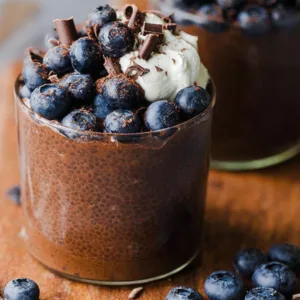 chocolate yogurt chia pudding in a jar with toppings