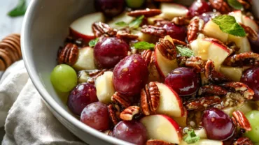 Cinnamon apple and red grape salad with honey and toasted pecans