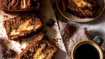 Cinnamon swirl banana bread loaf on table