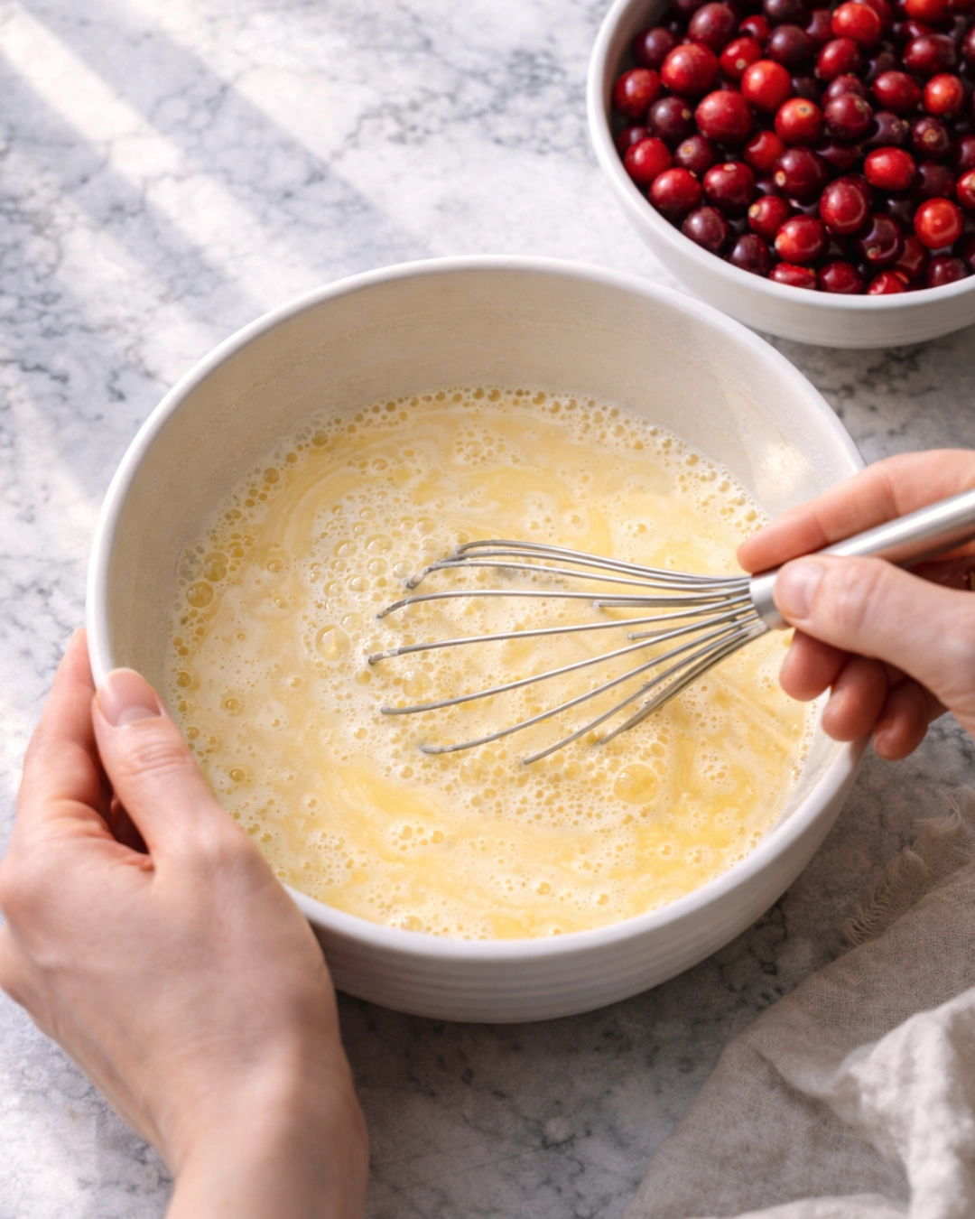 Whisking custard filling for cranberry custard pie