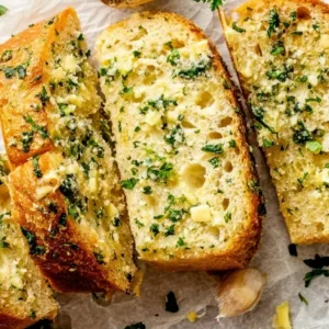 Homemade garlic bread with golden crust and melted butter