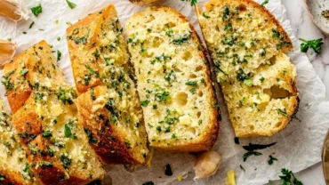 Homemade garlic bread with golden crust and melted butter