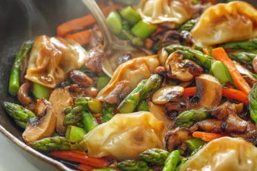 Potsticker stir fry with crispy dumplings, mushrooms, and vegetables in soy-vinegar glaze