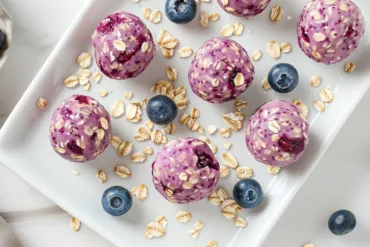 Blueberry cheesecake protein bites on plate
