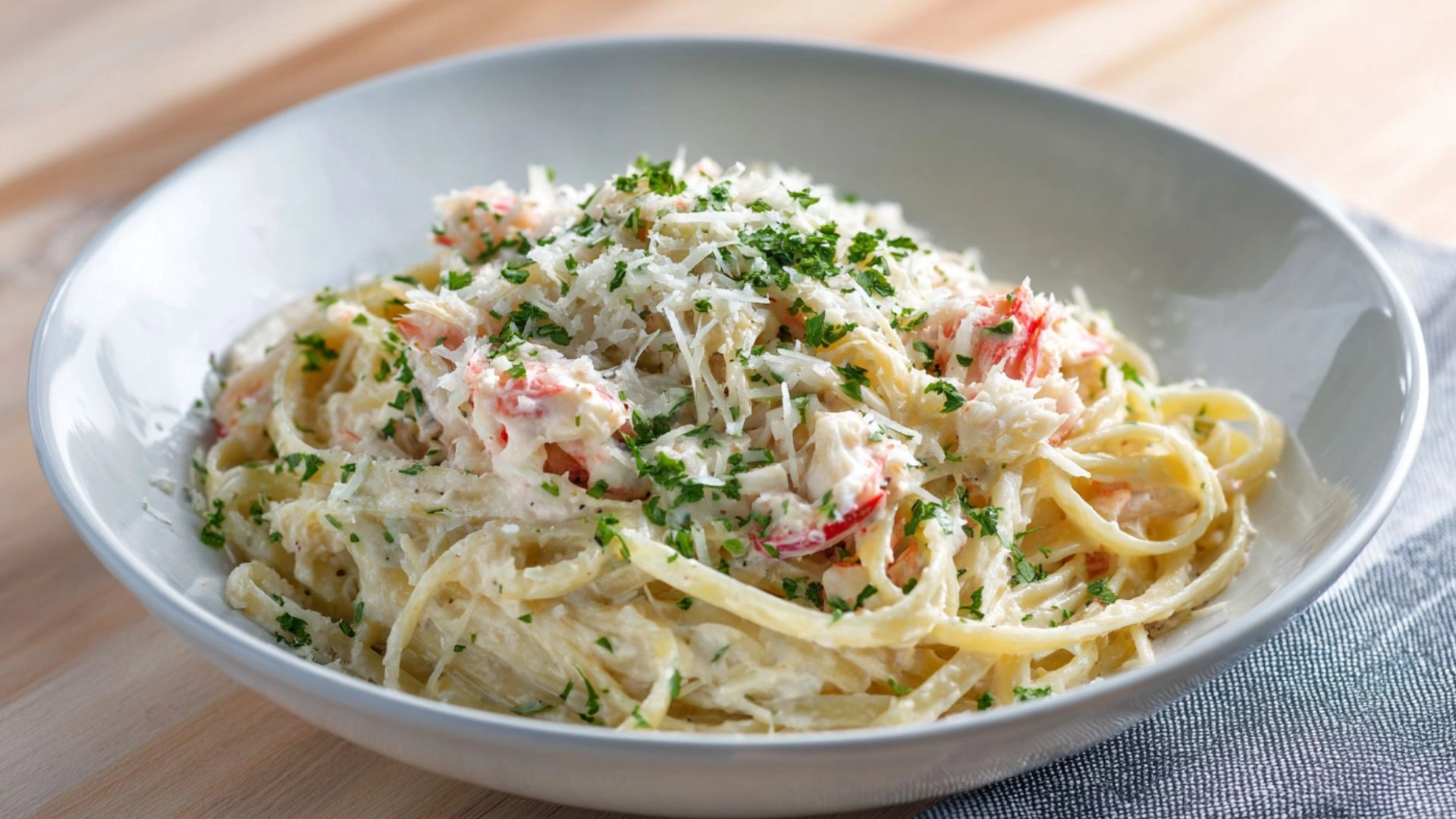 Copycat Red Lobster Crab Alfredo: 1 Easy Recipe That Tastes Like Magic 2 Copycat Red Lobster Crab Alfredo in a white bowl with Parmesan