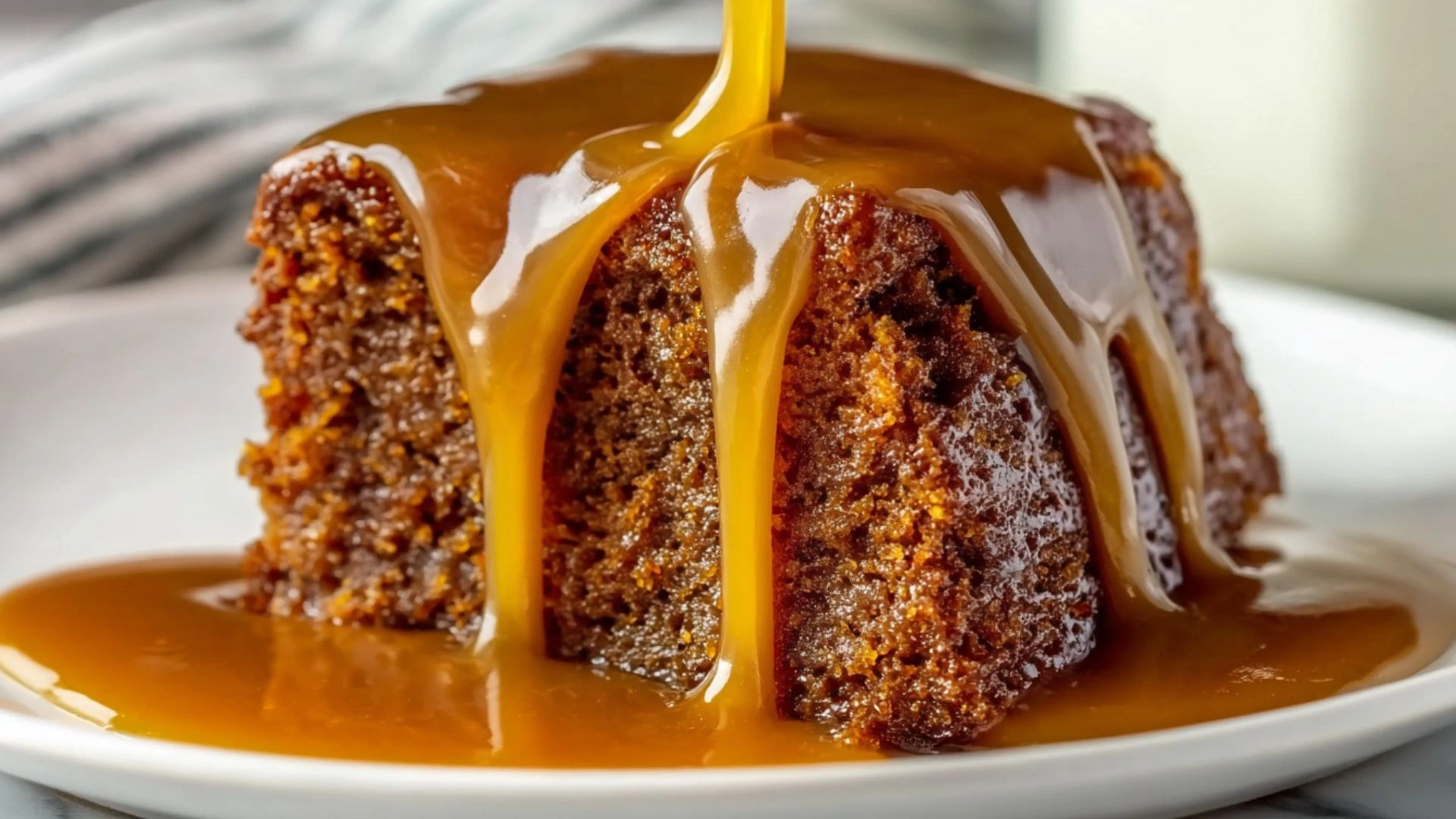 Decadent Sticky Toffee Pudding: 5 Secrets to Irresistible Comfort 2 Decadent Sticky Toffee Pudding dripping with golden toffee sauce on white plate