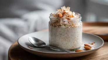 Tasty Coconut Cream Oats topped with almonds and coconut