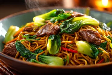 Beef and bok choy chow mein in a bowl