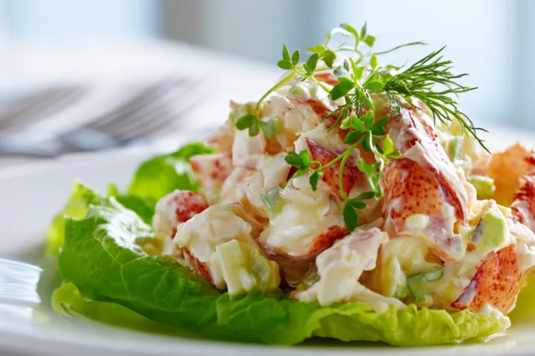 A delicious crab salad with fresh ingredients arranged beautifully on a plate.