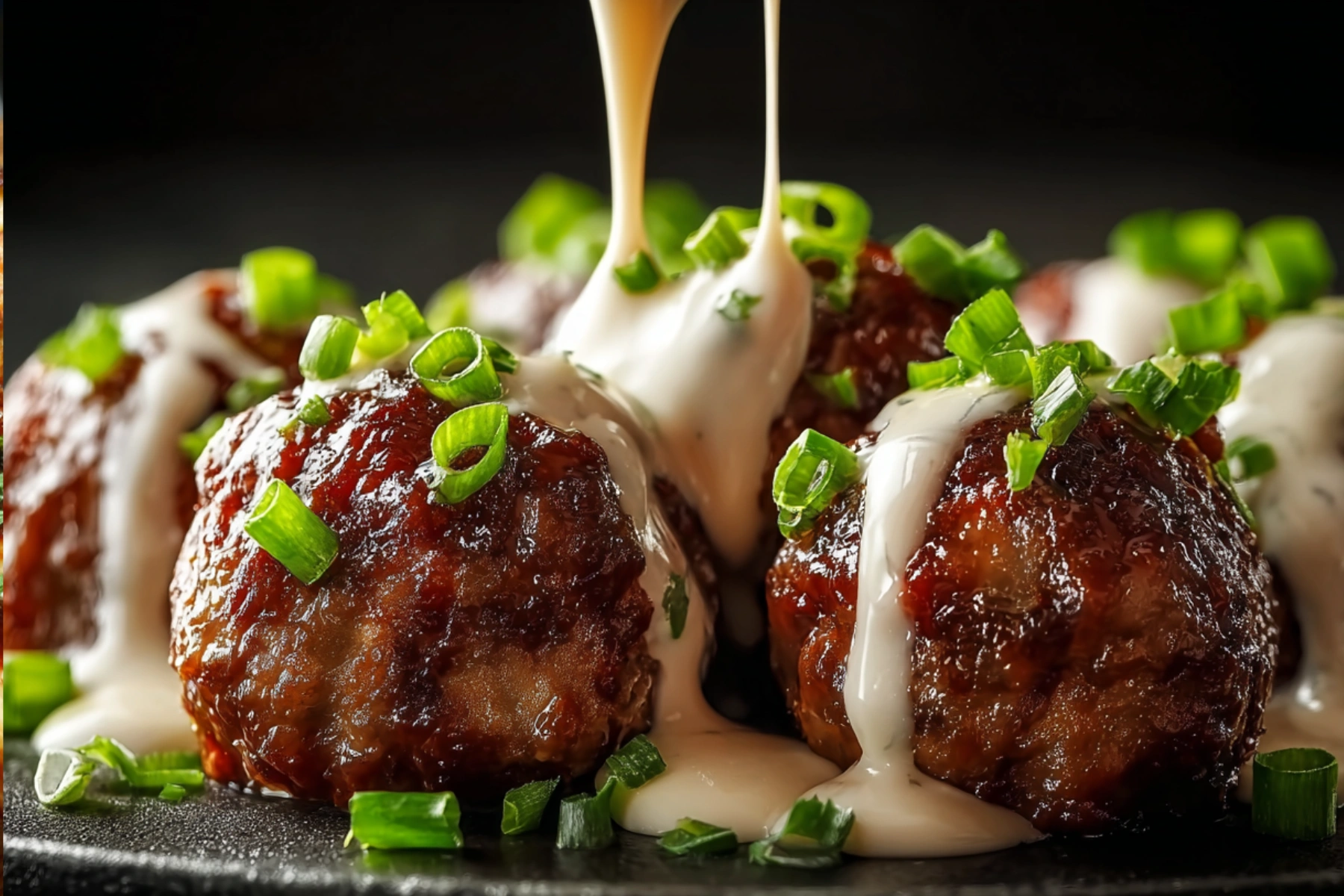 Korean BBQ meatballs served with spicy mayo dip on a plate