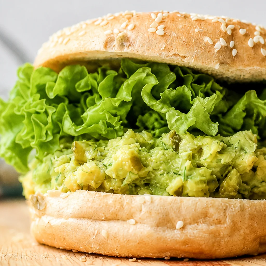 Chickpea Avocado Dill Pickle Sandwich with fresh herbs and crunch