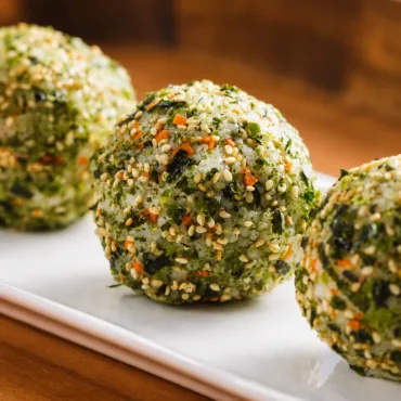 Delicious Korean Rice Balls (Jumeokbap) with various fillings like bulgogi and vegetables.