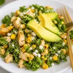Colorful Mexican Street Corn Kale Salad with avocado, corn, and creamy cilantro dressing.