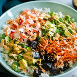 California Roll Sushi Bowl with crab, veggies, sushi rice, and spicy sriracha mayo