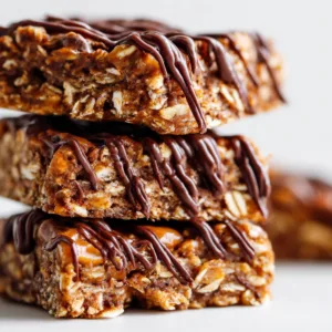 Healthy Chocolate Peanut Butter Oatmeal Bars stacked with chocolate topping