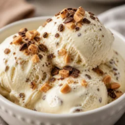Delicious No Churn Crème Brûlée Ice Cream with vanilla bean and caramelized sugar topping.