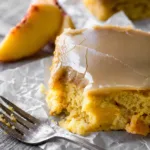 Vegan Peach Sheet Cake topped with irresistible brown sugar frosting and fresh peaches