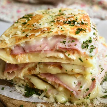 Delicious Chicken Cordon Bleu Quesadilla topped with creamy Dijon sauce.