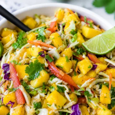 Colorful and fresh delicious Mango Slaw served as a side dish.