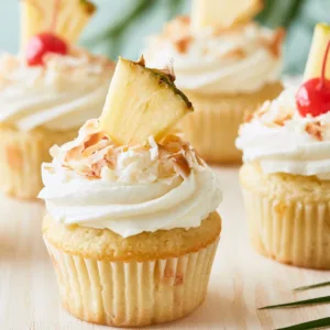 Hawaiian Cupcakes with pineapple, coconut, cream cheese frosting, and toasted coconut