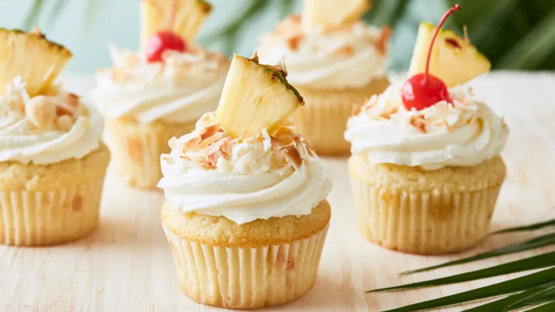 Hawaiian Cupcakes with pineapple, coconut, cream cheese frosting, and toasted coconut