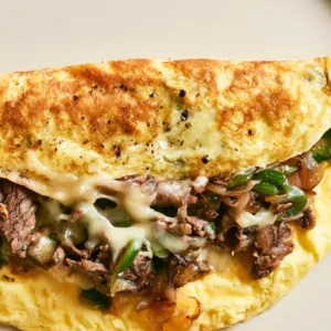 Philly Cheesesteak Omelette with steak, peppers, onions and melted provolone