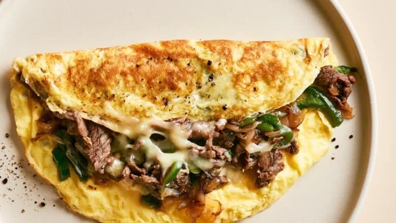 Philly Cheesesteak Omelette with steak, peppers, onions and melted provolone