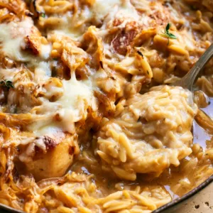 French Onion Chicken Orzo Casserole with caramelized onions and Gruyère