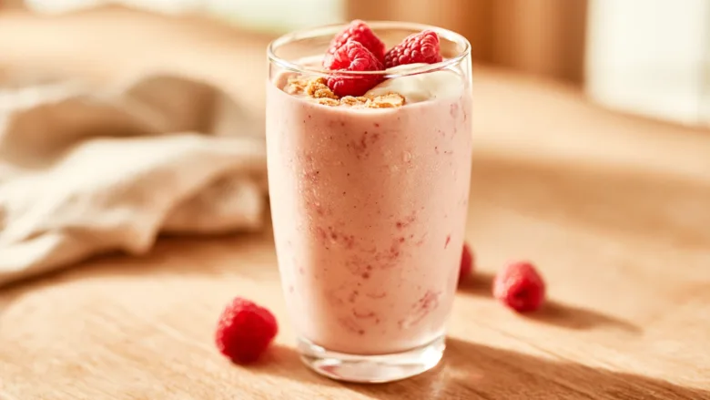 High Protein Raspberry Cheesecake Smoothie with fresh raspberries